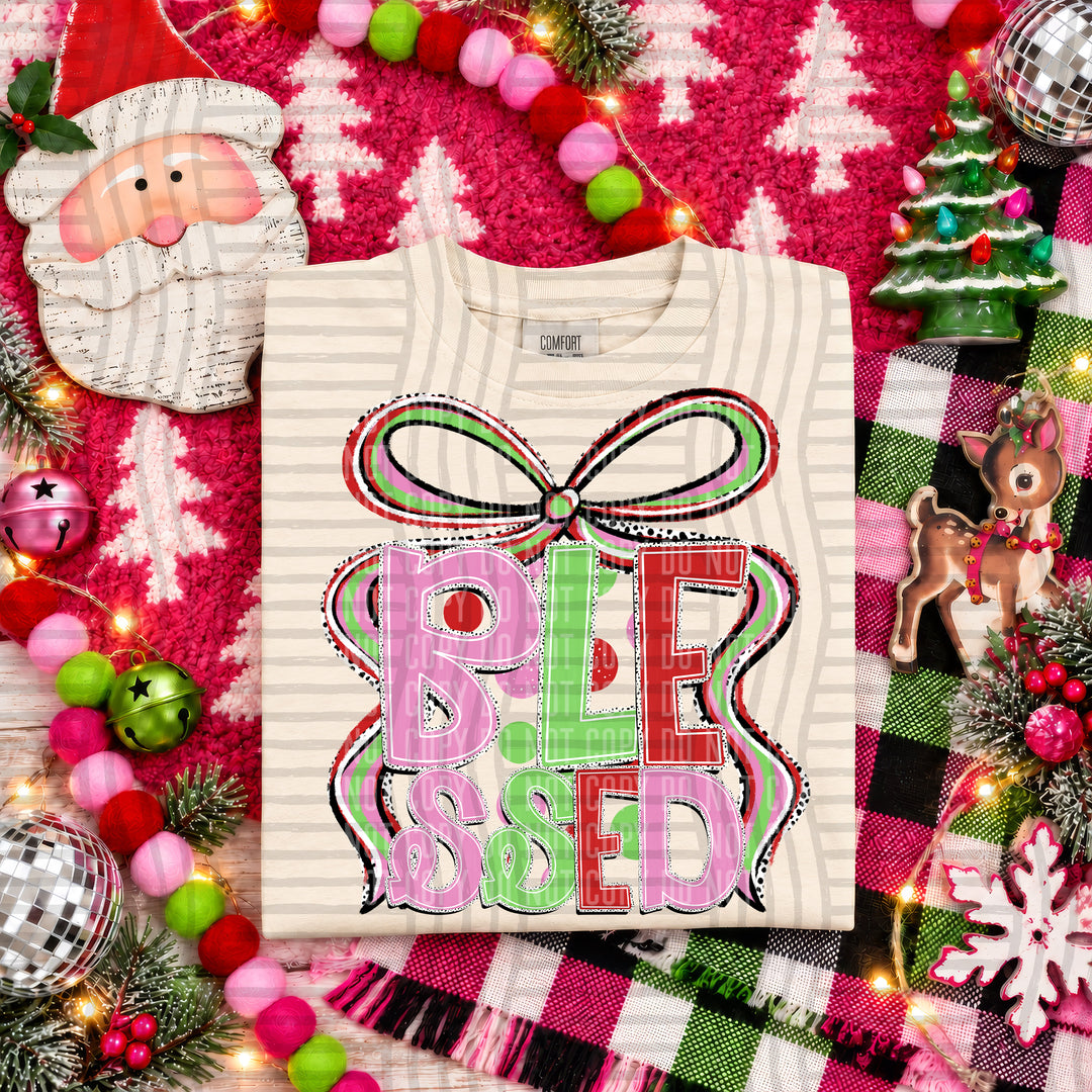 Blessed Christmas Bow DTF transfer pressed on a tee