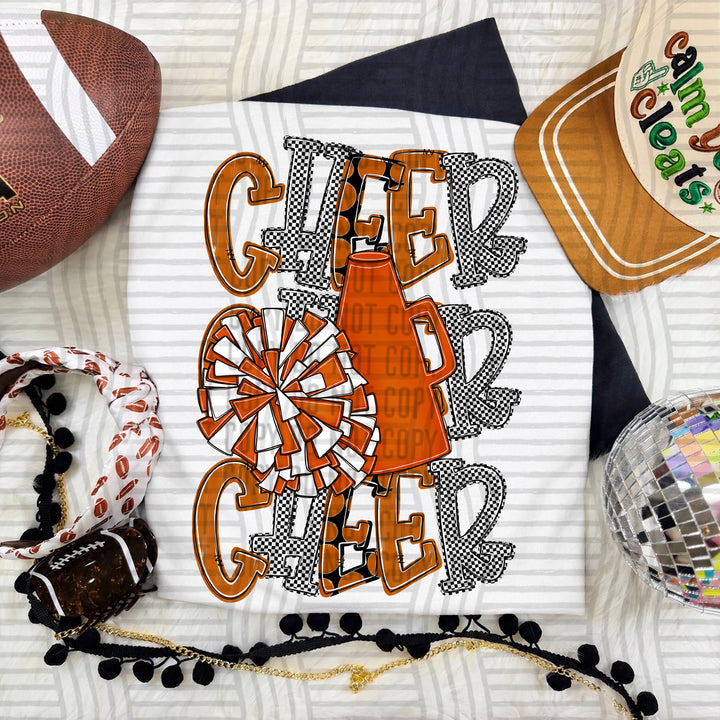 Burnt Orange Tri Stacked Cheer DTF transfer on a white tee