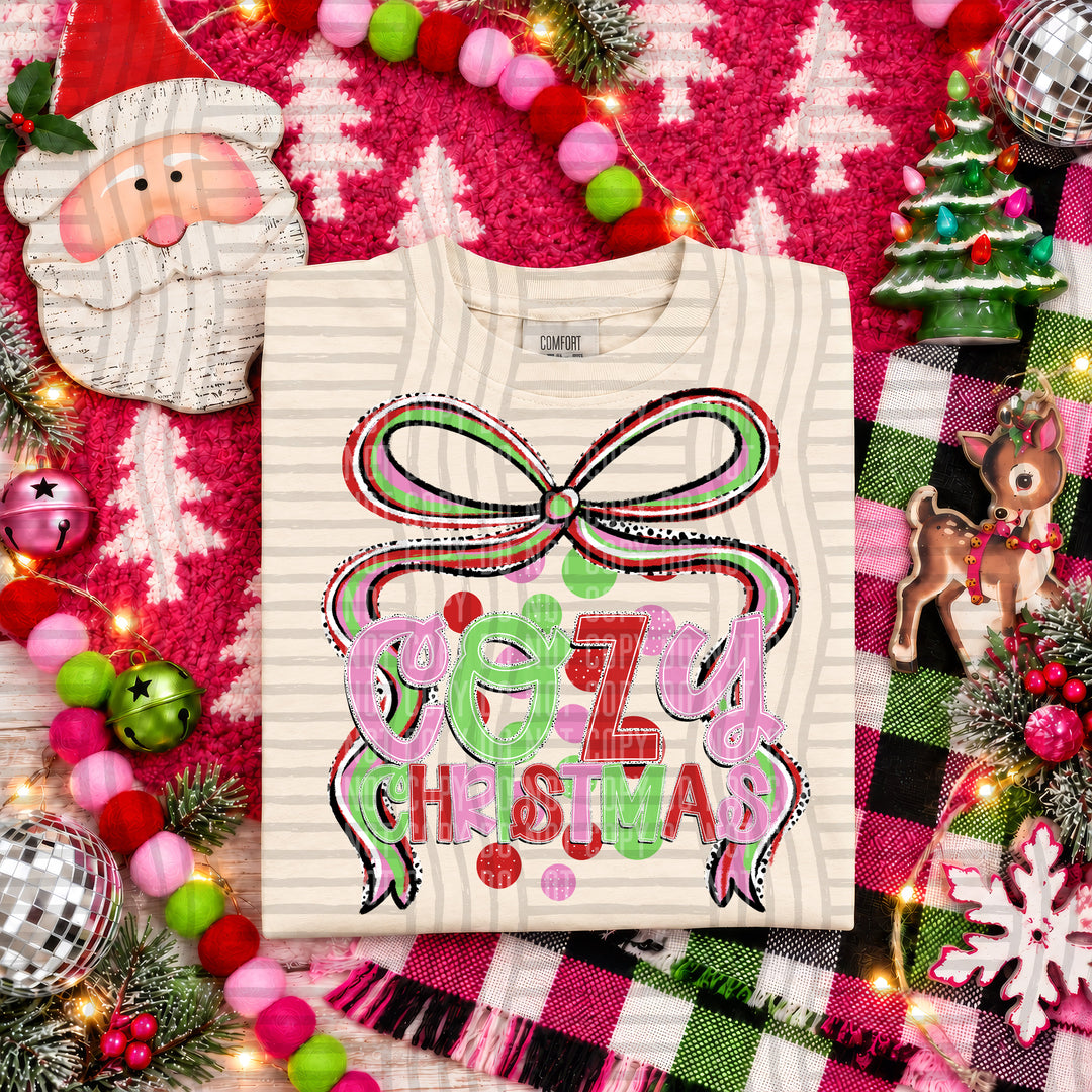 Cozy Christmas Christmas Bow DTF transfer pressed on a tee