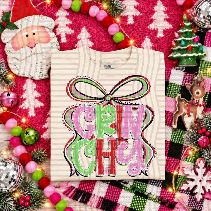 Grinchy Christmas Bow DTF transfer pressed on a tee