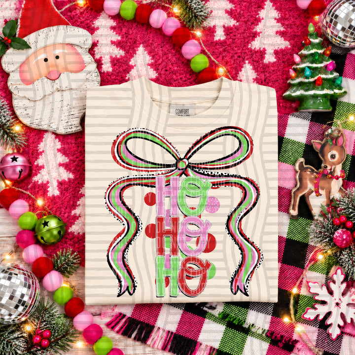 Ho Ho Ho Christmas Bow DTF transfer pressed on a tee