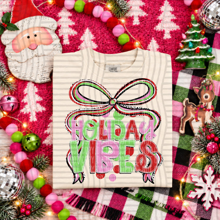 Holiday Vibes Christmas Bow DTF transfer pressed on a tee