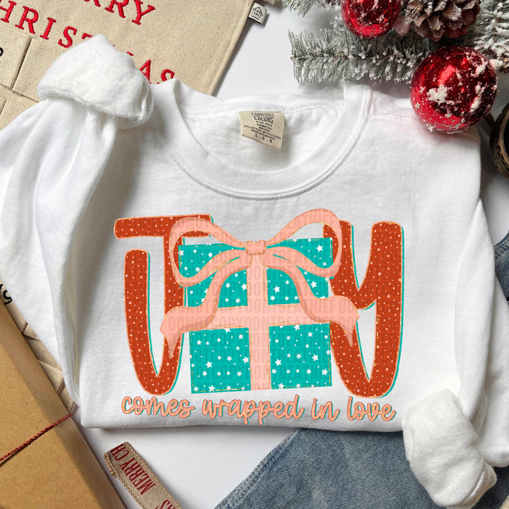 JOY COMES WRAPPED IN LOVE