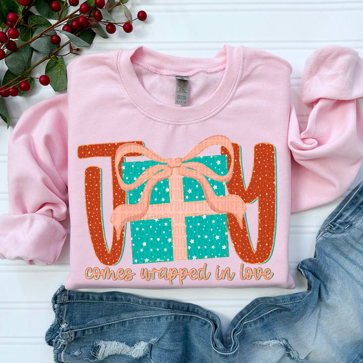 JOY COMES WRAPPED IN LOVE