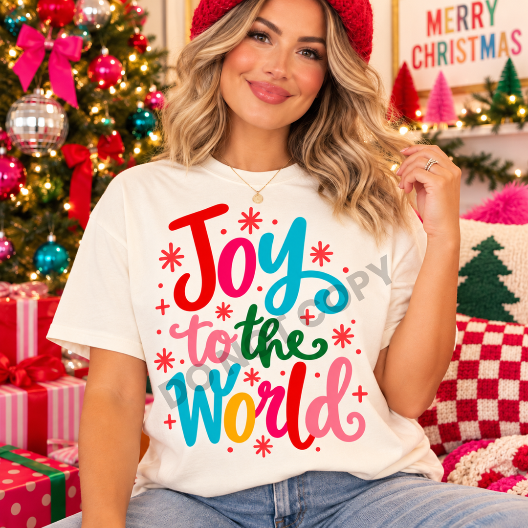 Joy to the World colorful script Christmas DTF transfer mockup on a cream tee
