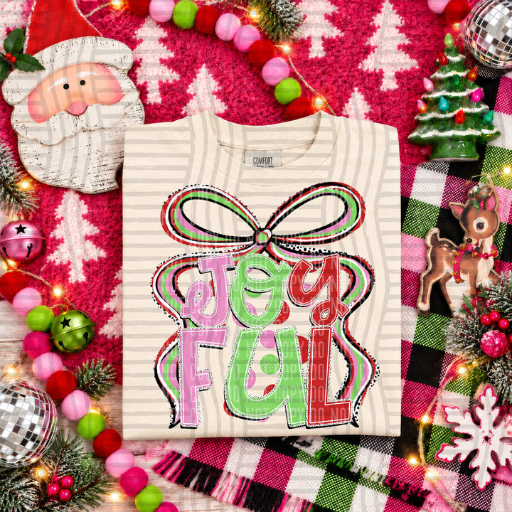 Joyful Christmas Bow DTF transfer pressed on a tee