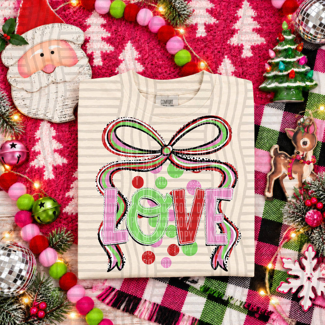 Love Christmas Bow DTF transfer pressed on a tee