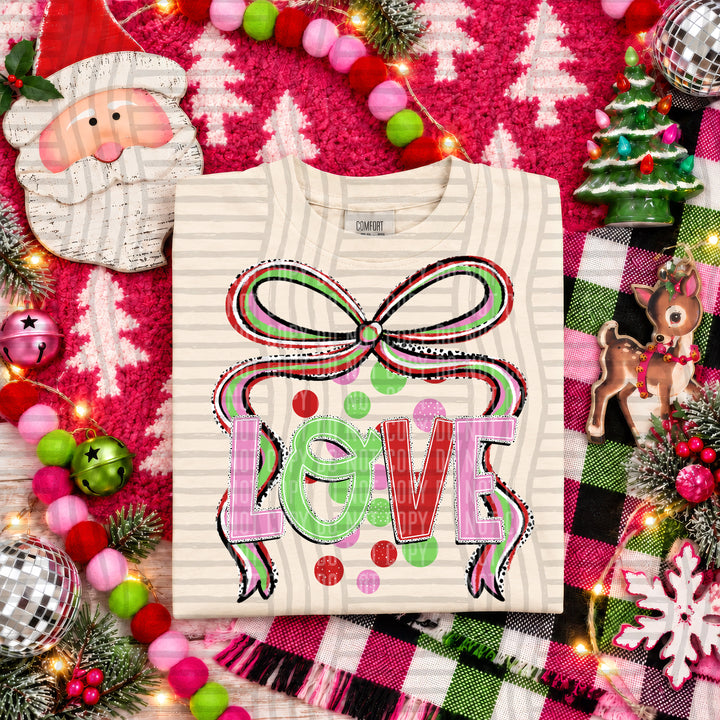 Love Christmas Bow DTF transfer pressed on a tee