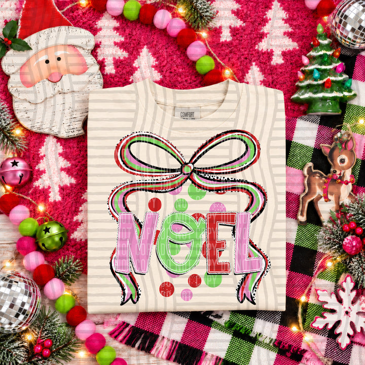Noel Christmas Bow DTF transfer pressed on a tee