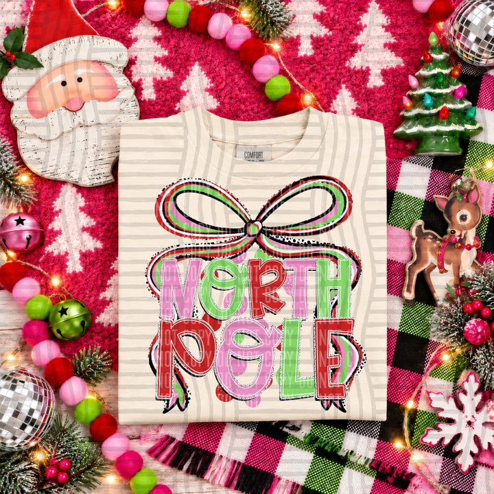 North Pole Christmas Bow DTF transfer pressed on a tee