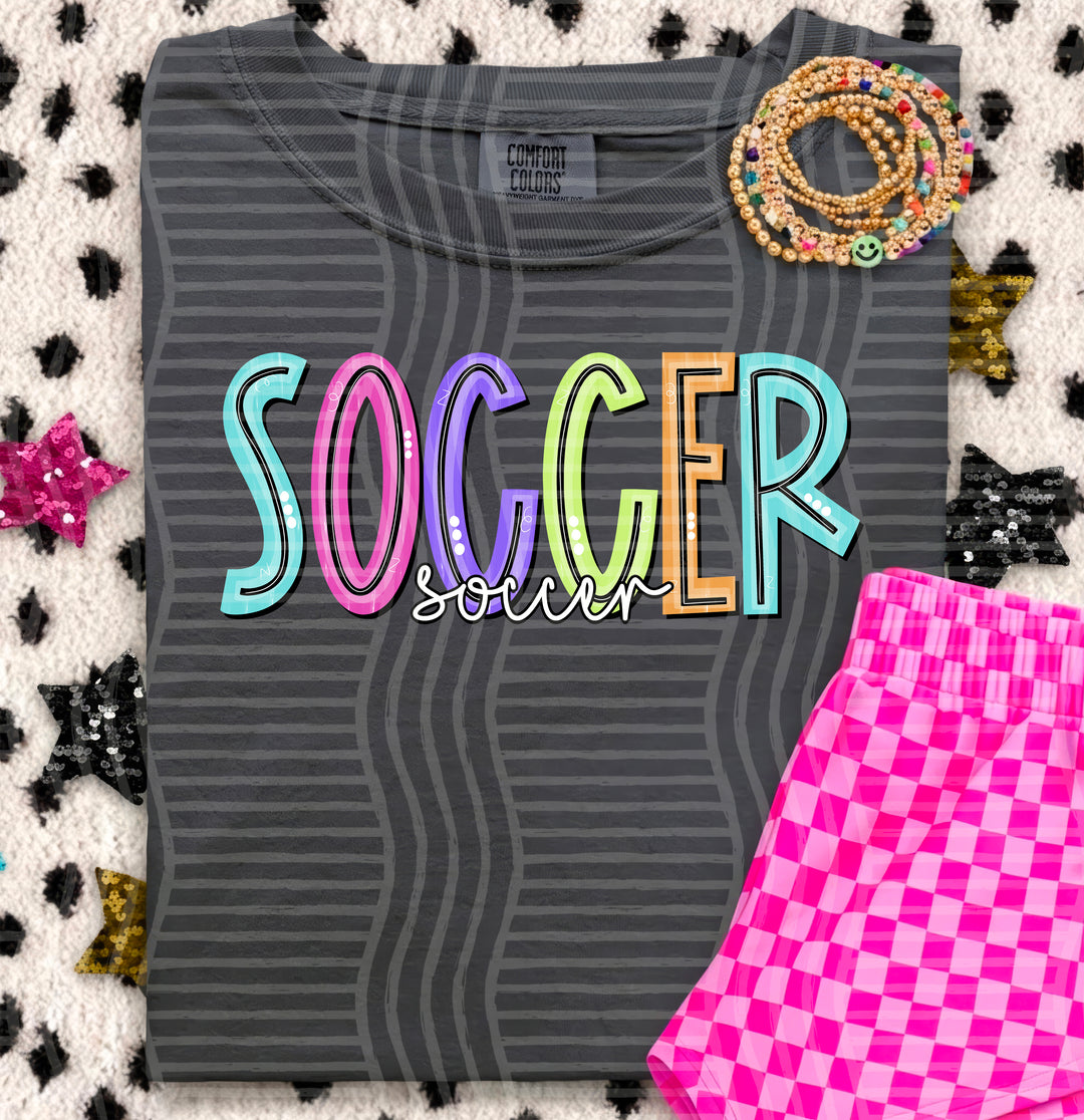 Soccer Game Day Doodles DTF transfer pressed on a tee