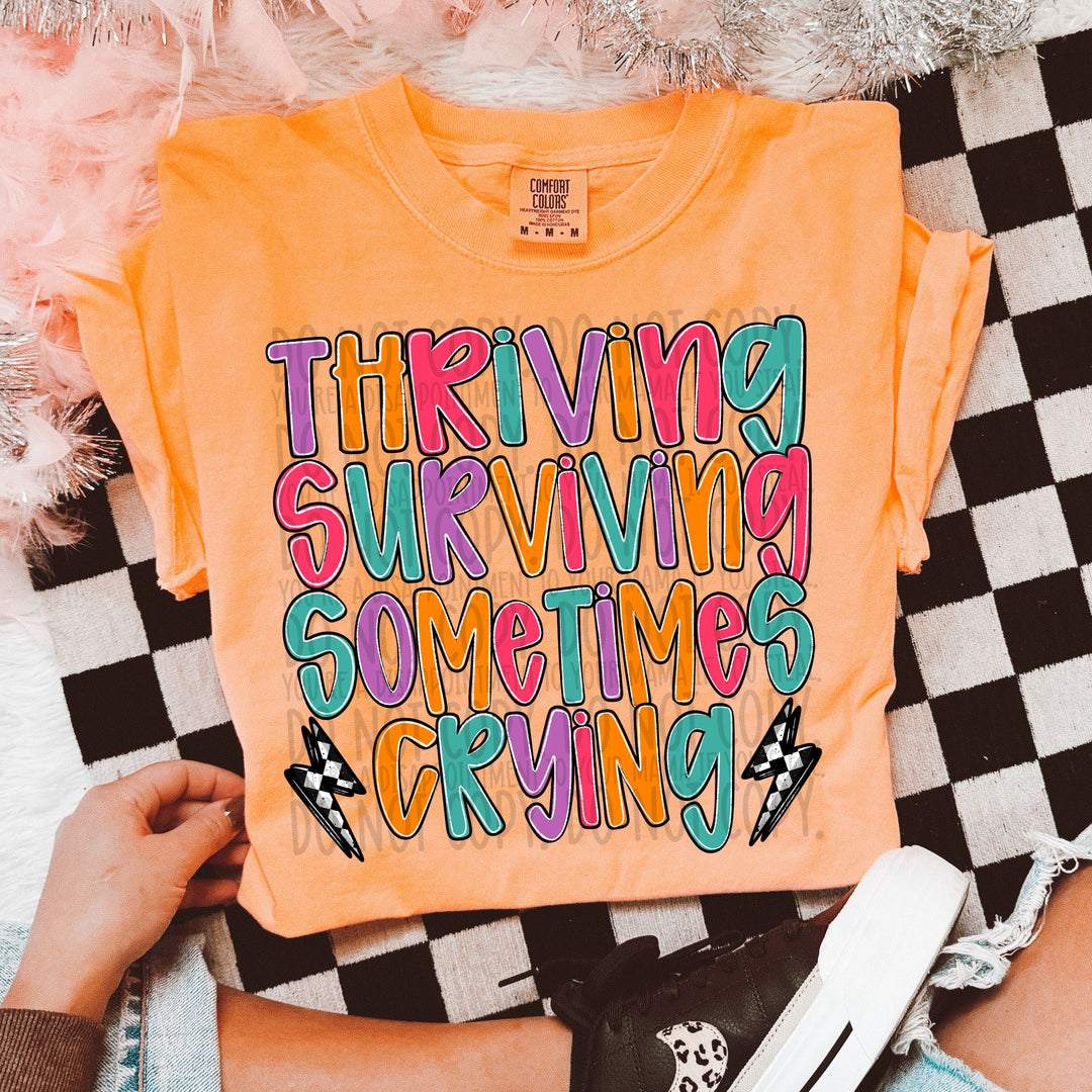 THRIVING SURVIVING SOMETIMES CRYING